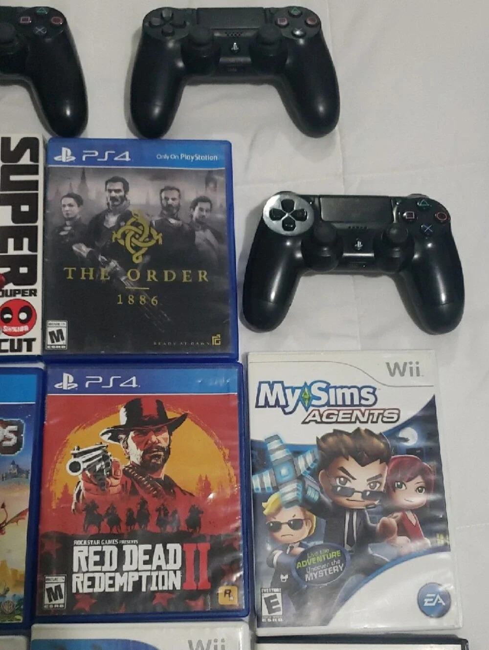 Sony Black PS4 Wireless Controllers with Mixed Game Bundle